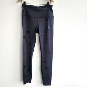 Black with black shiny star 90 degree reflex leggings size M. Never worn